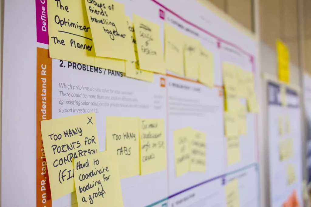 a board with a sticky notes for business plan